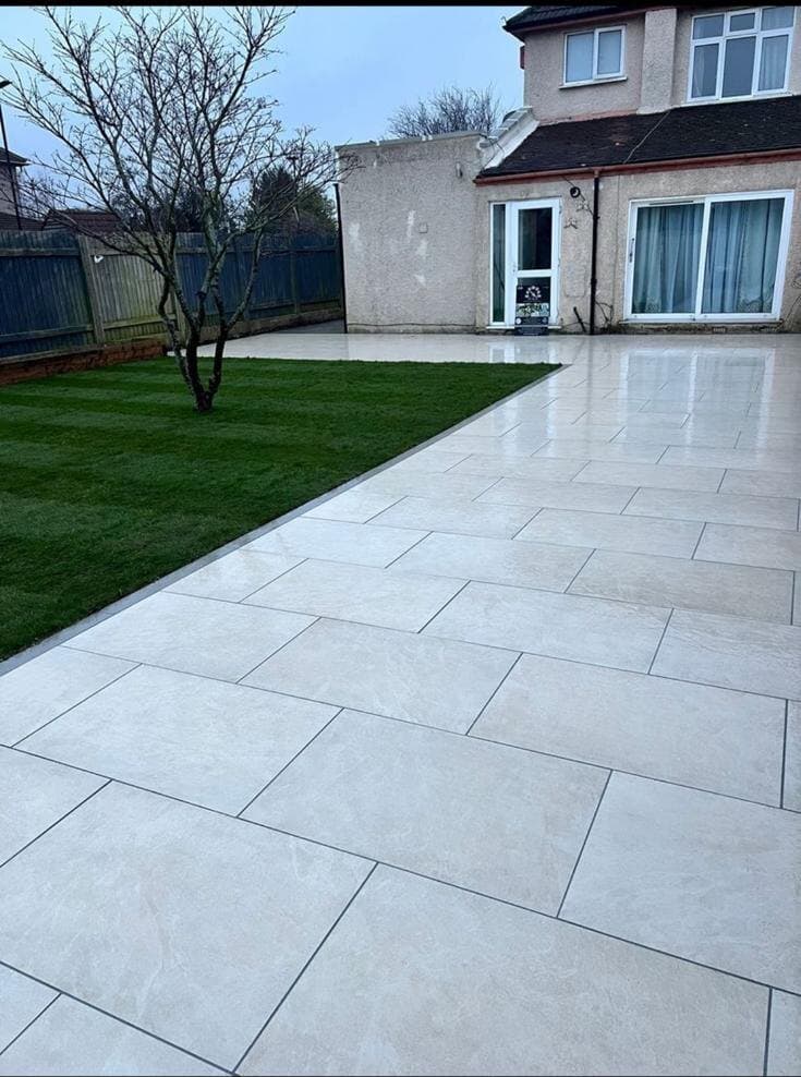 AMG Landscapes porcelain patio and lawn installation around a family garden